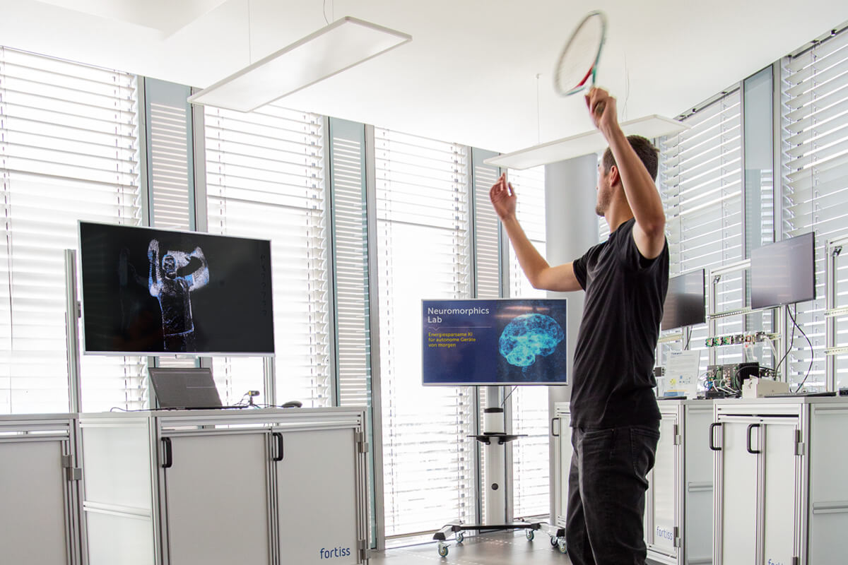 Researcher with a tennis racket