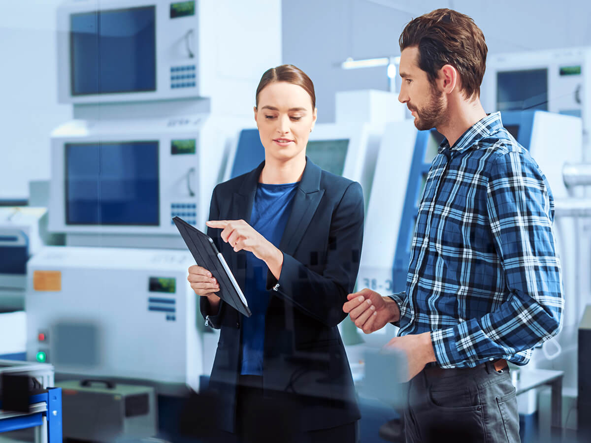 Man and woman in production hall
